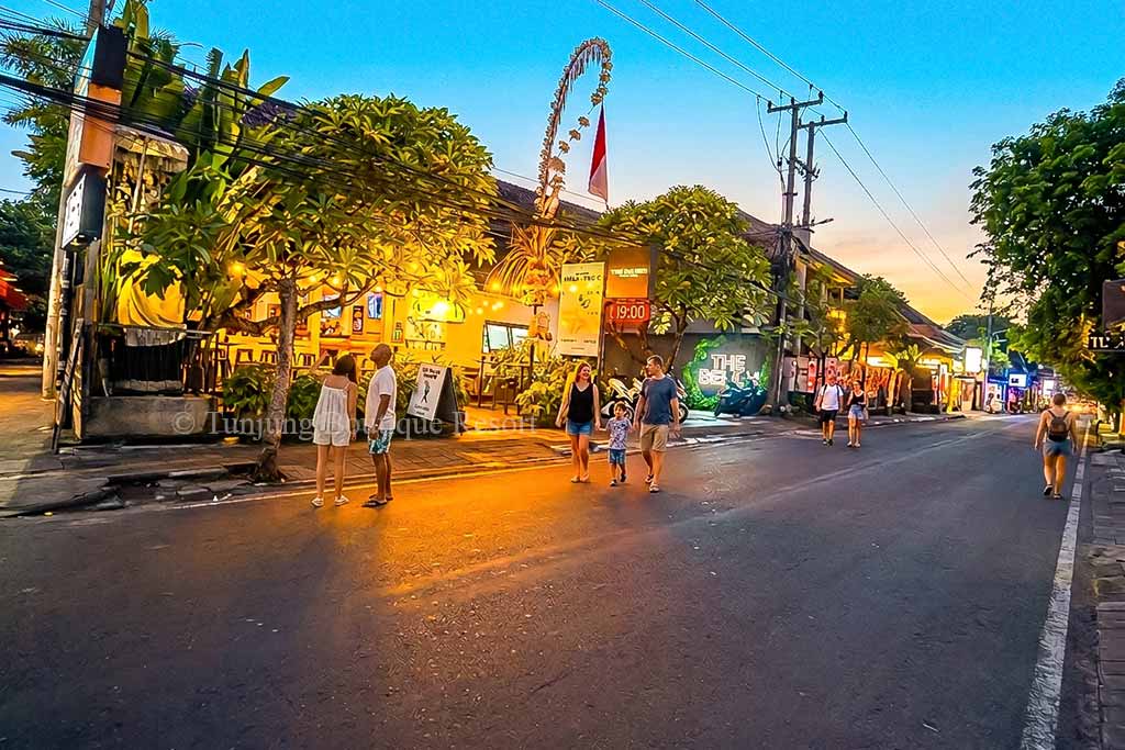 Canggu night streets near Berawa Beach featuring luxury hotels and soft romantic evening lighting.