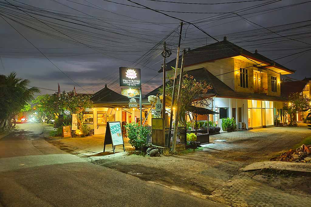 Peaceful Canggu night streets in front of The Tunjung Boutique Resort offering a quiet sanctuary after sunset.