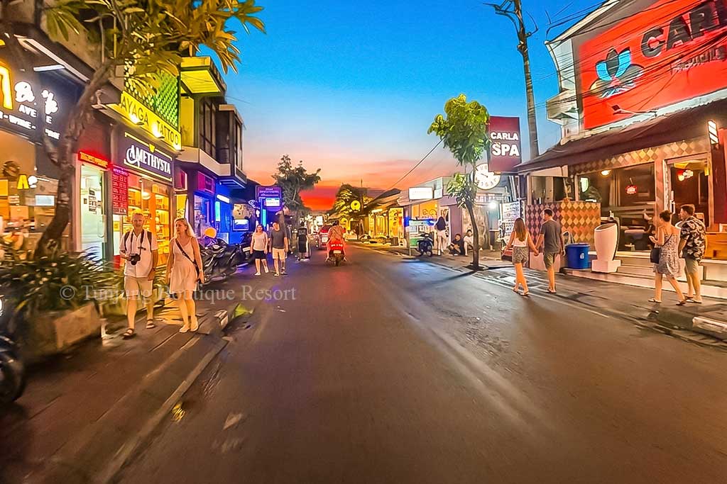 Canggu night streets through the vibrant village area offering lively restaurants, bars, and shops for tourists.