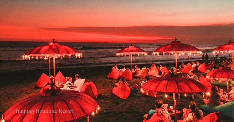 Canggu nightlife on the beach after dark featuring a romantic coastal evening atmosphere.