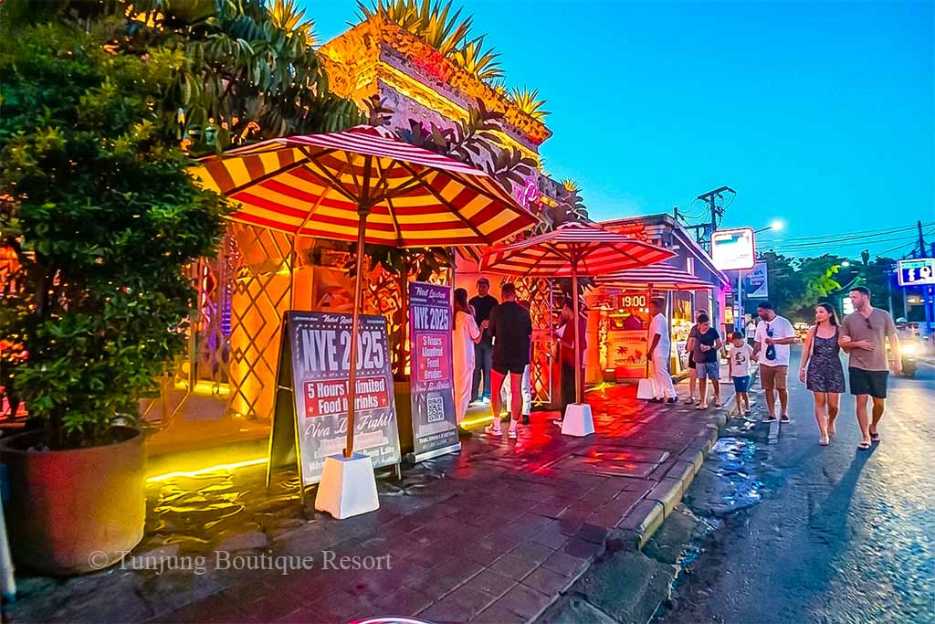 Canggu nightlife scene featuring dinner at a restaurant and drinks at a local cafe after sunset.