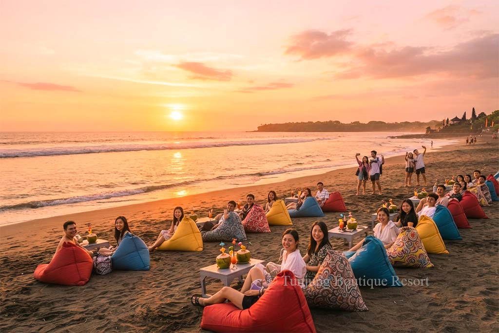Group of Asian travelers watching the beautiful ocean sunset during their stay in Canggu Bali.